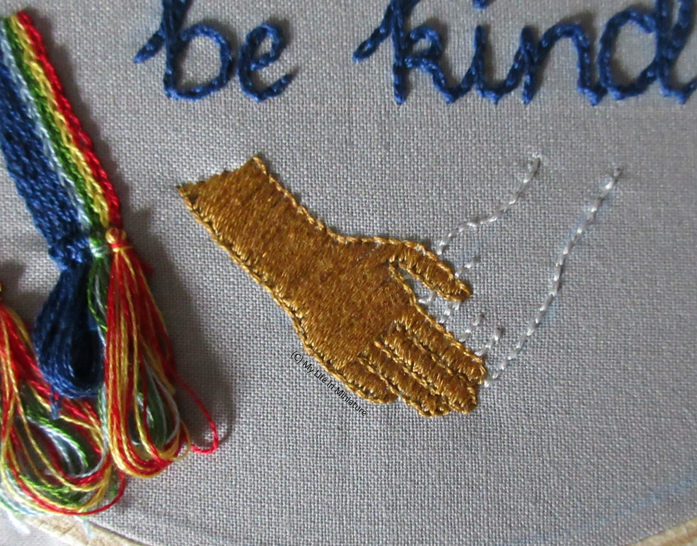 The bottom of the grey hoop is visible, showing the two hands. Now, the gold hand is filled in. 