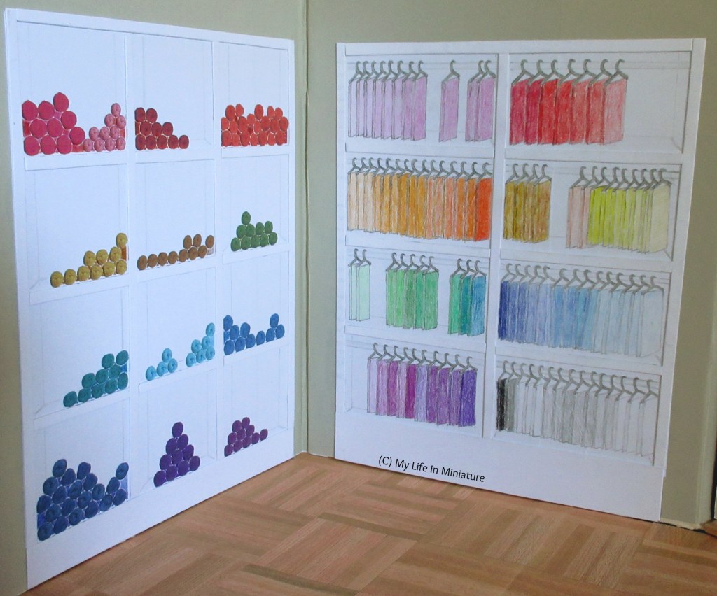 Both Needle & Thread's yarn shelves and fat quarter shelves are shown, complete. All shelves are stocked with yarn and fabric. 