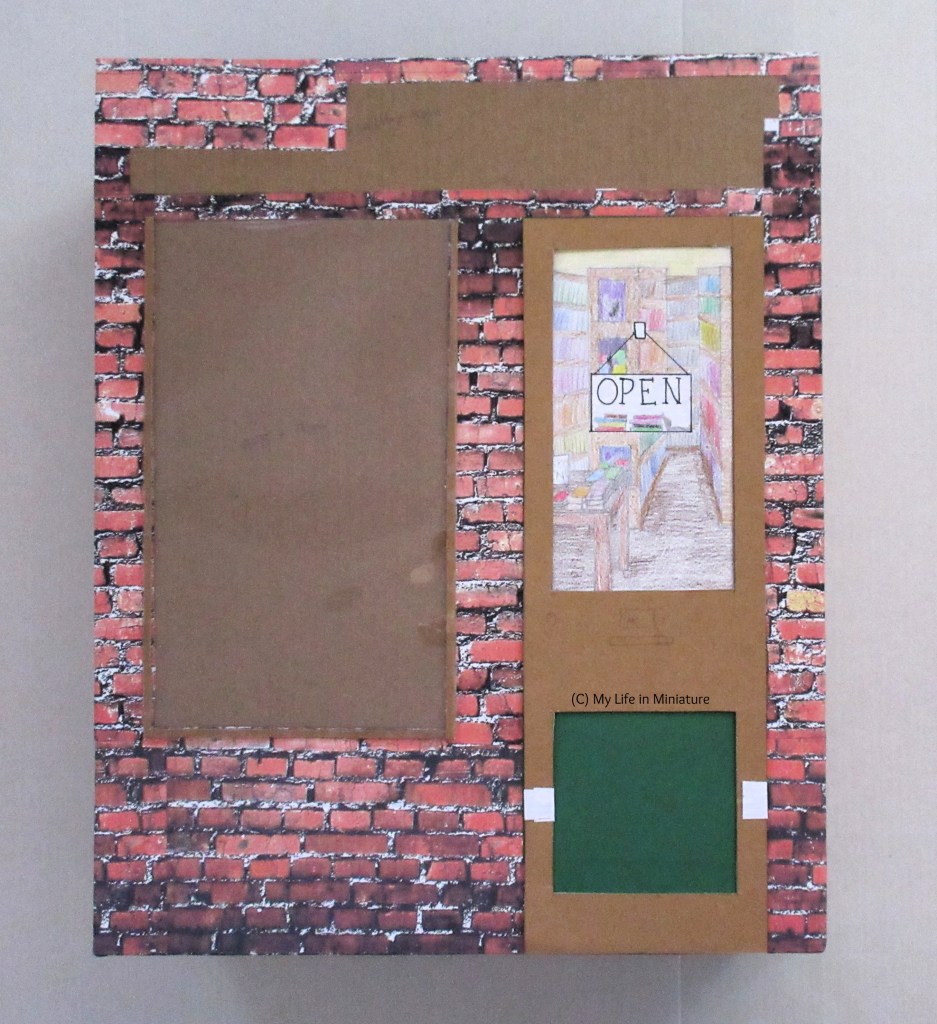 An unfinished storefront sits on a white background. There is a door on the right of the storefront, a window to the left, and space for a store name above the door and window. 